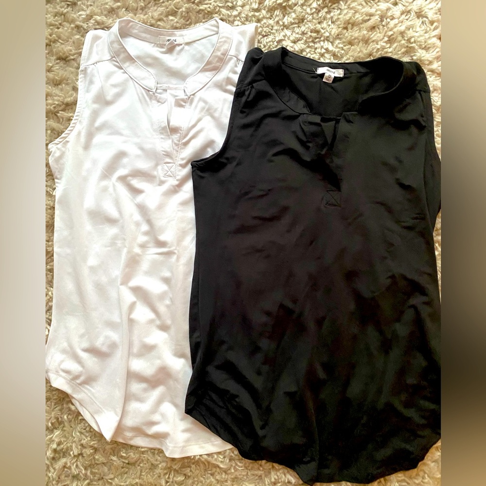 White and black tank tops; never worn; size xs